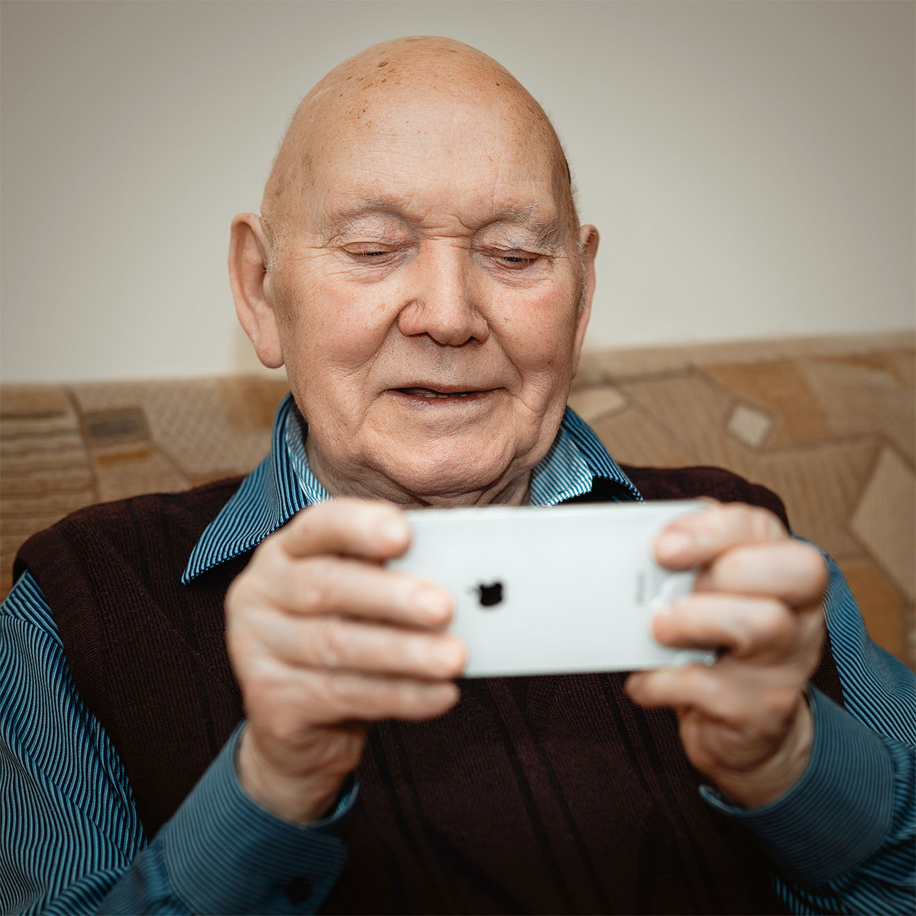resident holding a mobile phone