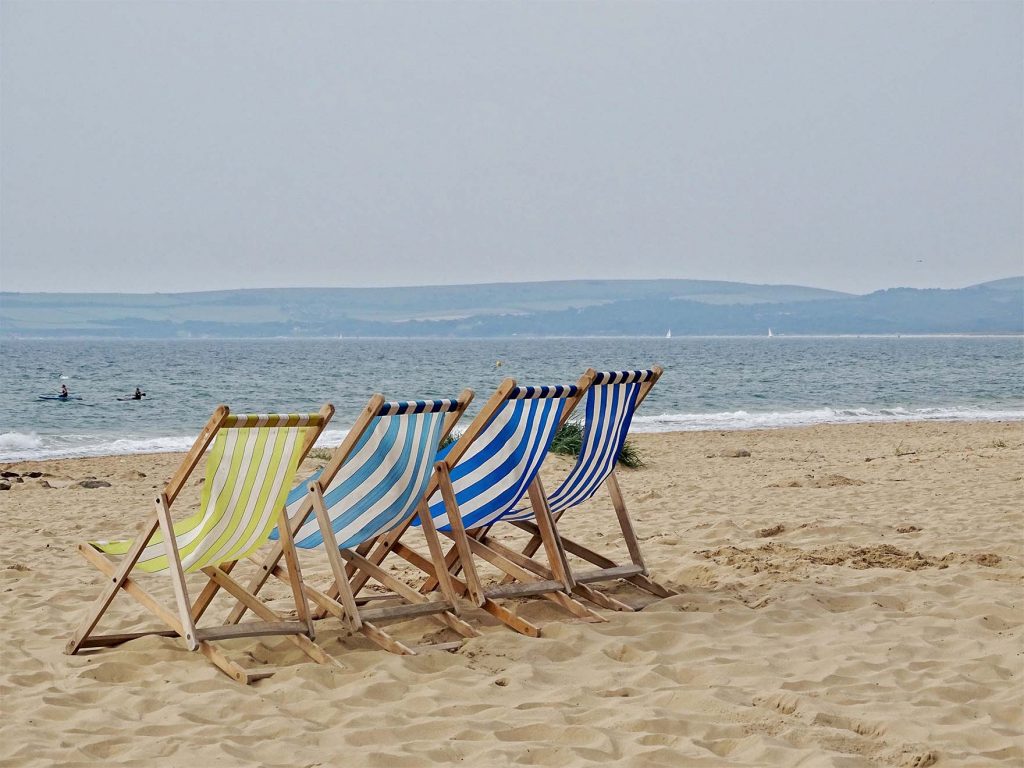 beach chairs on a sandy beach