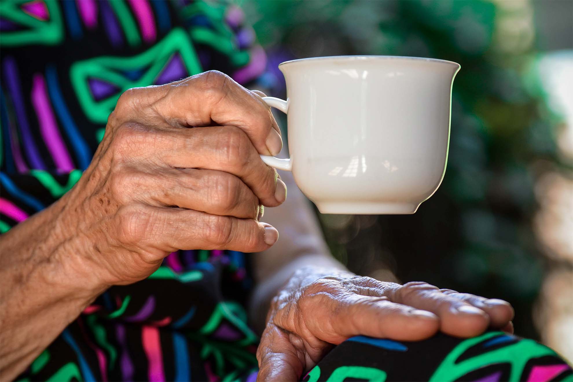 Resident holding tea cup