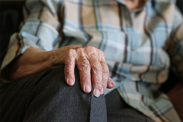 Resident with hand on his knee