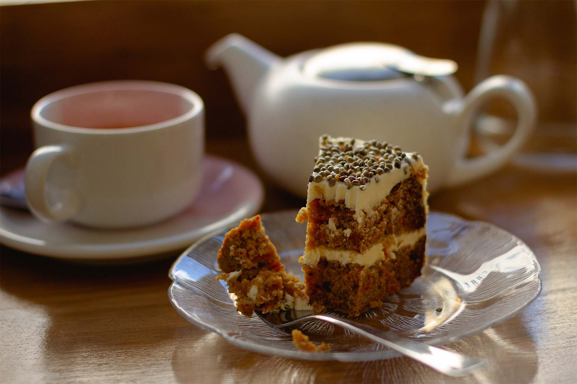 A cake on a plate with tea